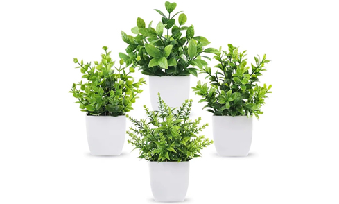 The finished product is fully assembled and ready to display, featuring a variety of plants and flowers in various forms. It requires no watering or f