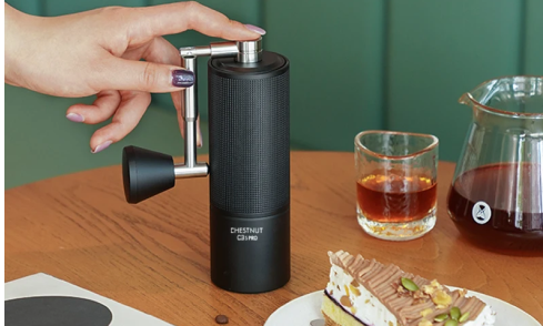 Premium manual coffee grinder with precision conical burrs, designed for professional coffee making. 